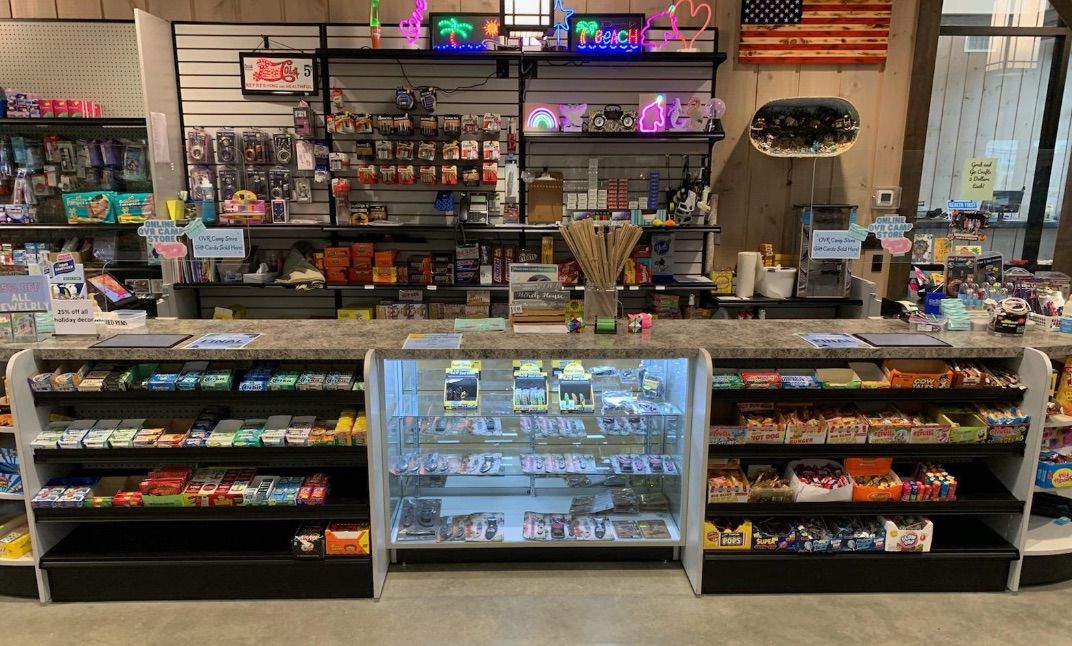 Complete convenience store setup with shelving and display case