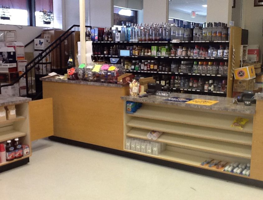 Liquor store retail counter and shelving system
